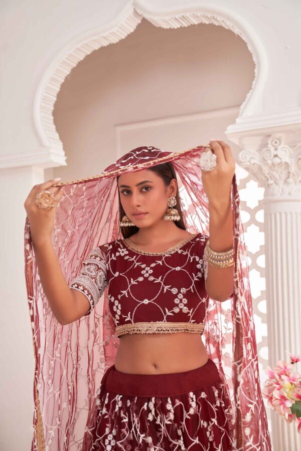 Reddish maroon net lehenga choli