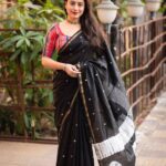 black saree with hand block print work and muticolor blouse
