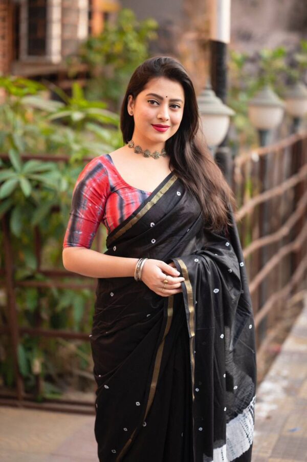 black saree with hand block print work and muticolor blouse