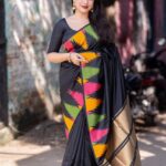 black silk saree with tassels and blouse
