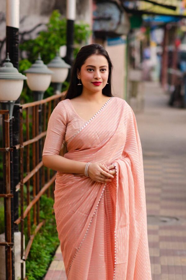 Peach color chiffon saree with silver lining work