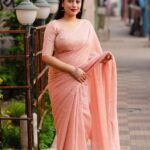 Peach color chiffon saree with silver lining work