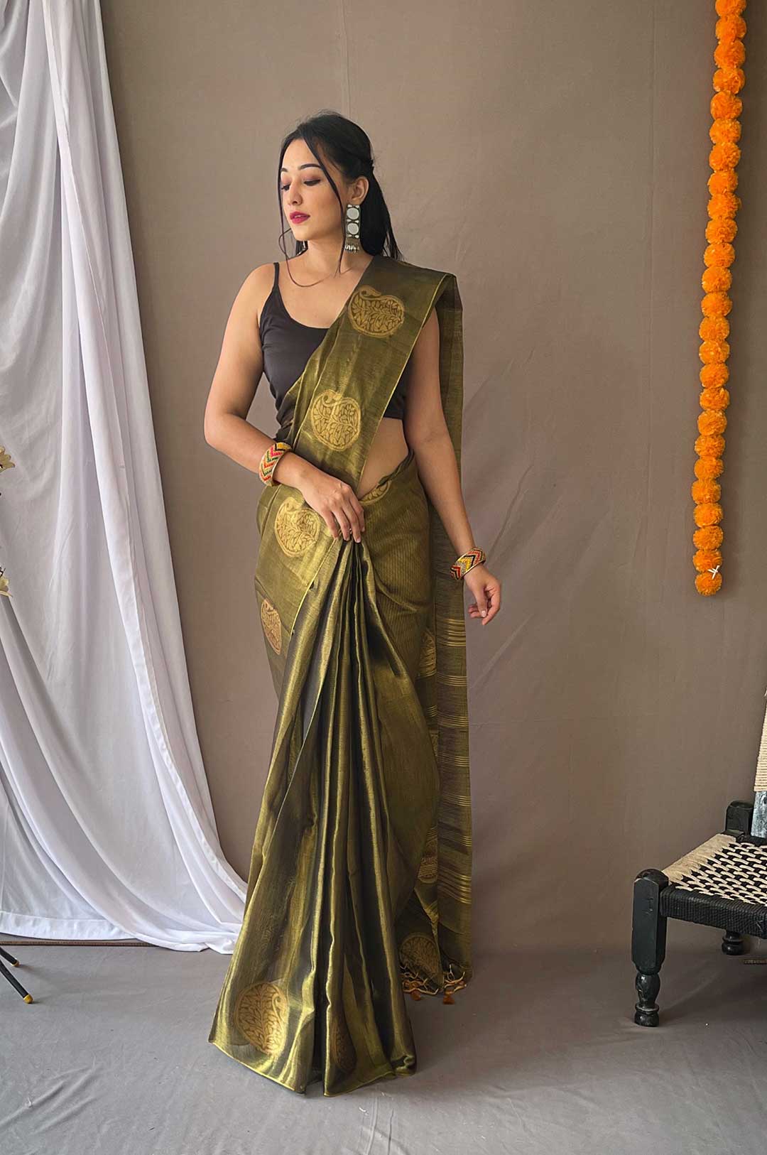 Bottle Green Tissue Silk Saree with Zari Weaving and Mango Border