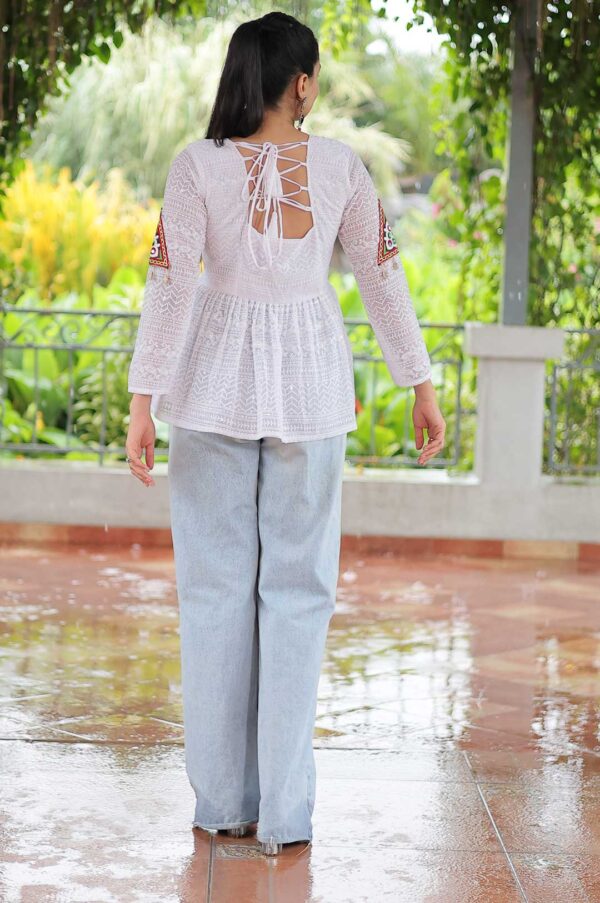 White Georgette Schiffli Peplum Top with Kutchi Gamthi Patch Work
