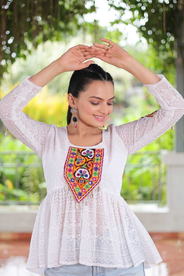 White Georgette Schiffli Peplum Top with Kutchi Gamthi Patch Work