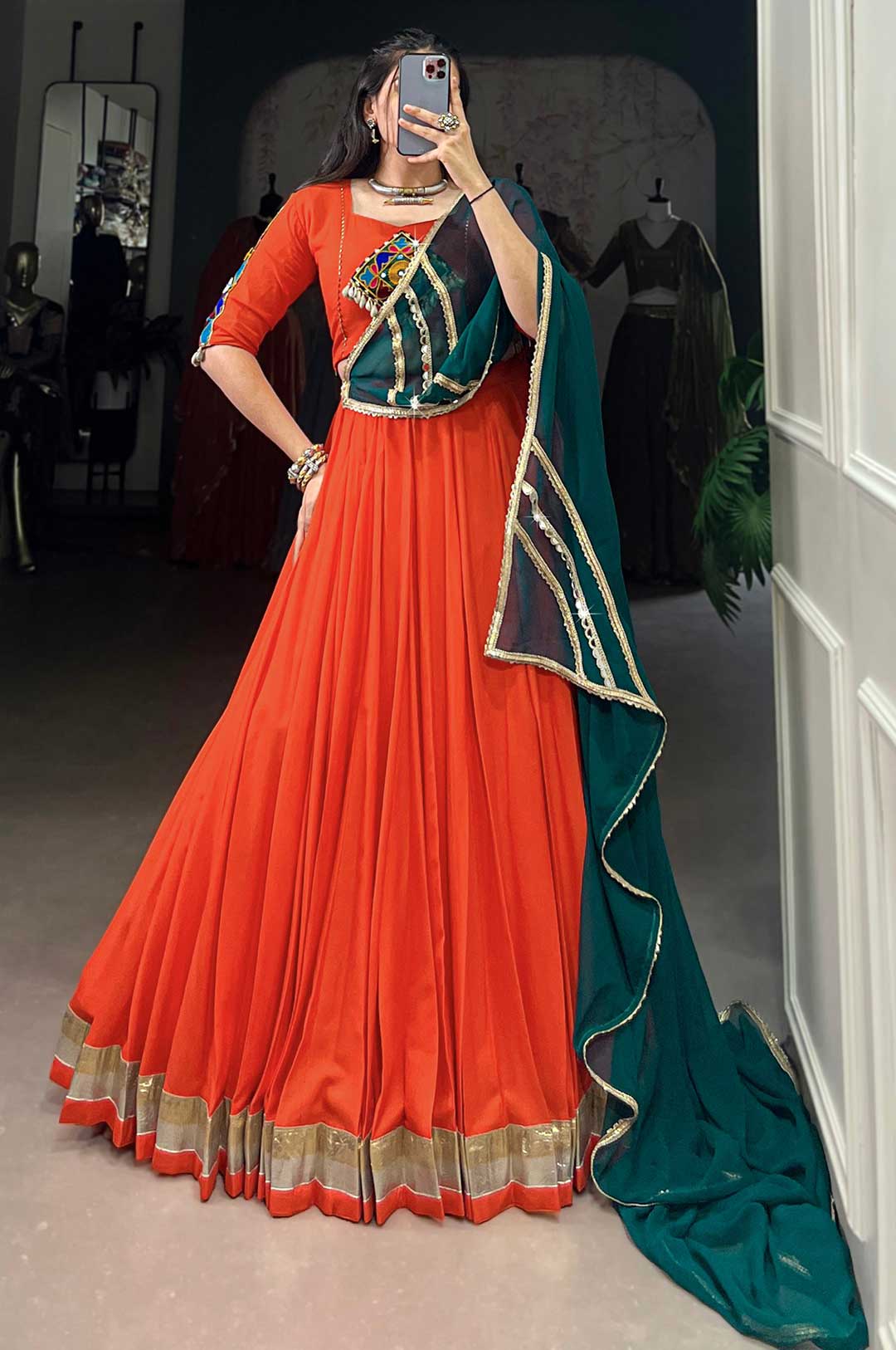 Orange Pure Rayon Embossed Lehenga with Mirror Gamthi Work Blouse & Dark Green Georgette Dupatta