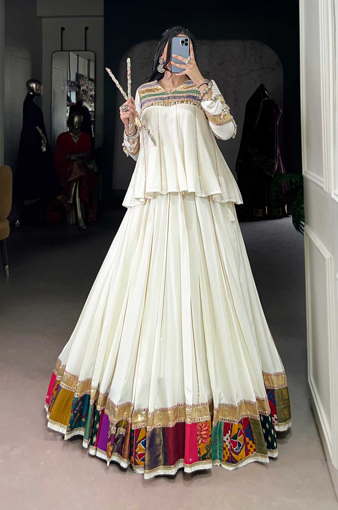 White Lehenga Choli With A Multi-Colored Patchwork Or Embroidered Border