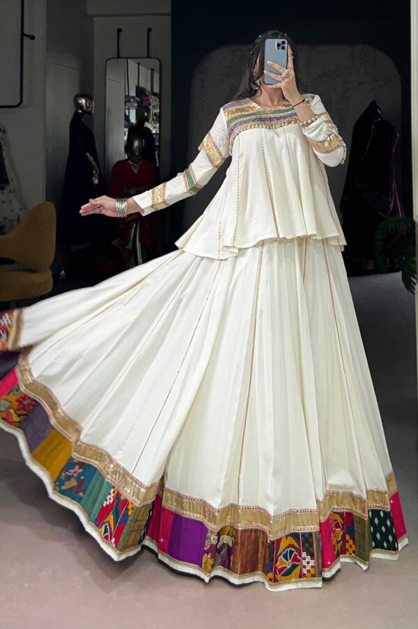 White Lehenga Choli With A Multi-Colored Patchwork Or Embroidered Border