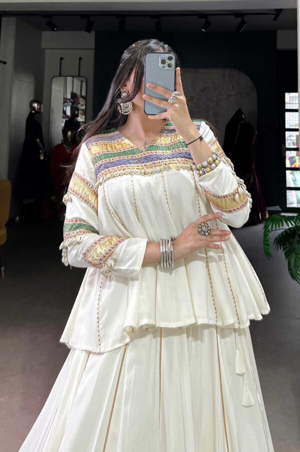 White Lehenga Choli With A Multi-Colored Patchwork Or Embroidered Border